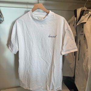 Bound (UK) white T shirt with blue mosaic design on back. Medium.